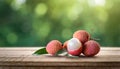 Lychee on wood with a blurred green background