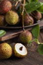 Lychees on a dark wooden table in the kitchen,Litchi chinensis Sonn,lizhi,close up