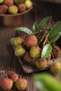 Lychees on a dark wooden table in the kitchen,Litchi chinensis Sonn,lizhi,close up