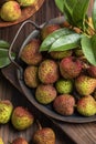 Lychees on a dark wooden table in the kitchen,Litchi chinensis Sonn,lizhi,close up