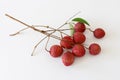 Lychees fruits with leaf on white background.