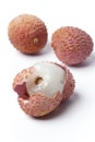 Lychees from which one has a broken skin