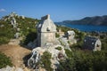 Lycian rock tombs, Rock sarcophagus at ancient Lycian necropolis on hill in Simena Kalekoy, Turkey Royalty Free Stock Photo