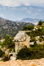 Lycian tombs against the backdrop of the mountains in Simena. Royalty Free Stock Photo