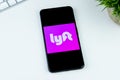 Lyft app logo on a smartphone screen. Royalty Free Stock Photo
