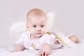 Lying baby with angel wings Royalty Free Stock Photo