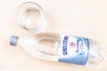 Lying bottle of Gerolsteiner water and glass