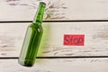 Lying bottle, red paper message. Royalty Free Stock Photo