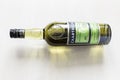 Lying closed bottle of green Chartreuse liqueur