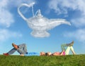 Lying couple on grass and dream alladin lamp cloud Royalty Free Stock Photo