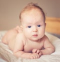 Lying cute blond baby girl Royalty Free Stock Photo