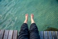Lying feet to the sea Royalty Free Stock Photo