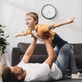 Lying in floor and holding adorabe Royalty Free Stock Photo