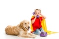 Lying golden retriever with shocked little supergirl talking on phone