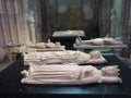 Lying marble statues above tombs in Saint Denis Cathedral in Paris, France.