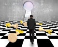 Lying money chess with businessman walking toward keyhole Royalty Free Stock Photo