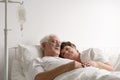 Lying next to sick husband Royalty Free Stock Photo