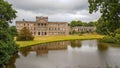 Lyme Hall and its pond inside Lyme Park in Cheshire, England.