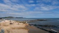 LYME REGIS, DORSET, ENGLAND - MAY 7 2023: View of Church Cliff Beach with tourists.