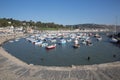Lyme Regis harbour Dorset England UK with boats on a beautiful calm still day on the English Jurassic Coast Royalty Free Stock Photo