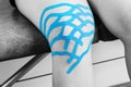 Lymphatic knee technique, two fan strips. Kinesiology Tape in si Royalty Free Stock Photo