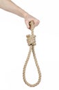 Lynching and suicide theme: man's hand holding a loop of rope for hanging on white isolated background Royalty Free Stock Photo