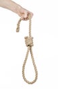 Lynching and suicide theme: man's hand holding a loop of rope for hanging on white isolated background