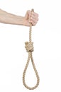 Lynching and suicide theme: man's hand holding a loop of rope for hanging on white isolated background