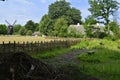 Lyngby, Denmark - July 2021: Various old farm houses from different regions and a small old windmill displayed in Old Denmark