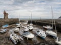 LYNMOUTH, DEVON, SEPTEMBER 11 2022: Boats in Lynmouth harbour at low tide.