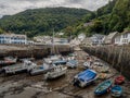 LYNMOUTH, DEVON, SEPTEMBER 11 2022: Boats in Lynmouth harbour at low tide.