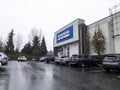 Lynnwood, WA USA - circa February 2022: Angled view of the entrance to a Bed Bath and Beyond store on a cloudy, overcast day