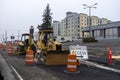 Lynnwood, WA USA - circa February 2022: View of a construction bulldozer in the heart of downtown, clearing the way for the