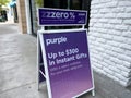 Lynnwood, WA USA - circa July 2023: Angled view of a sandwich board sign for Purple mattresses at the Alderwood Mall