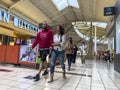 Lynnwood, WA USA - circa June 2022: Wide angle view of people shopping inside the Alderwood Mall