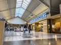 Lynnwood, WA USA - circa June 2022: Wide angle view of people shopping inside the Alderwood Mall