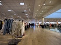 Lynnwood, WA USA - circa March 2023: Wide view of people shopping inside a Nordstrom clothing store in the Alderwood Mall