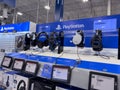 Lynnwood, WA USA - circa March 2023: Wide view of Playstation headsets for sale inside a Best Buy store Royalty Free Stock Photo