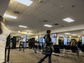 Lynnwood, WA USA - circa November 2022: Wide view of people inside the Lynnwood DMV building, updating and applying for licenses