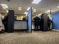 Lynnwood, WA USA - circa November 2022: Wide view of people inside the Lynnwood DMV building, updating and applying for licenses