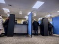 Lynnwood, WA USA - circa November 2022: Wide view of people inside the Lynnwood DMV building, updating and applying for licenses