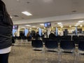 Lynnwood, WA USA - circa November 2022: Wide view of people inside the Lynnwood DMV building, updating and applying for licenses