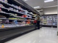 Lynnwood, WA USA - circa September 2022: Wide angle view of a bearded man shopping in the yogurt and dairy aisle inside a Target