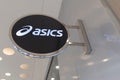 Asics logo brand and text sign of Japanese multinational chain shoes athletic facade wall store