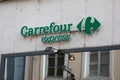 carrefour express text brand and logo sign on wall chain facade town store entrance shop small