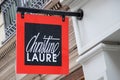 Christine Laure logo text and brand store sign of shop facade chain women clothing