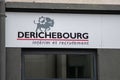 Derichercourg sign logo and text brand on wall building facade Temporary work agency company
