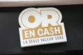 or en cash logo brand and sign text front signage chain store buying gold to cash french shop on