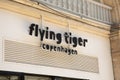 Flying Tiger Copenhagen logo brand and text sign front facade entrance city store of danish home