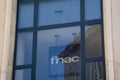 Fnac brand shop logo and text sign front facade windows entrance store electronic cultural